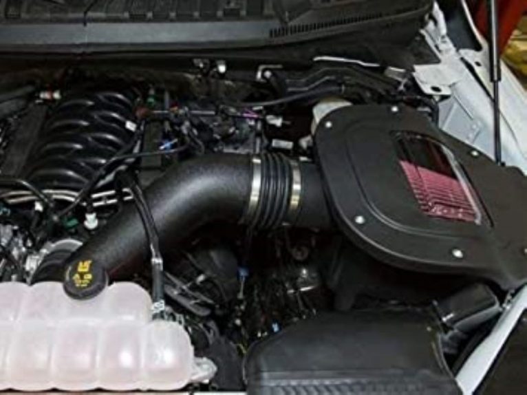A car engine with its hood open  Description automatically generated with medium confidence