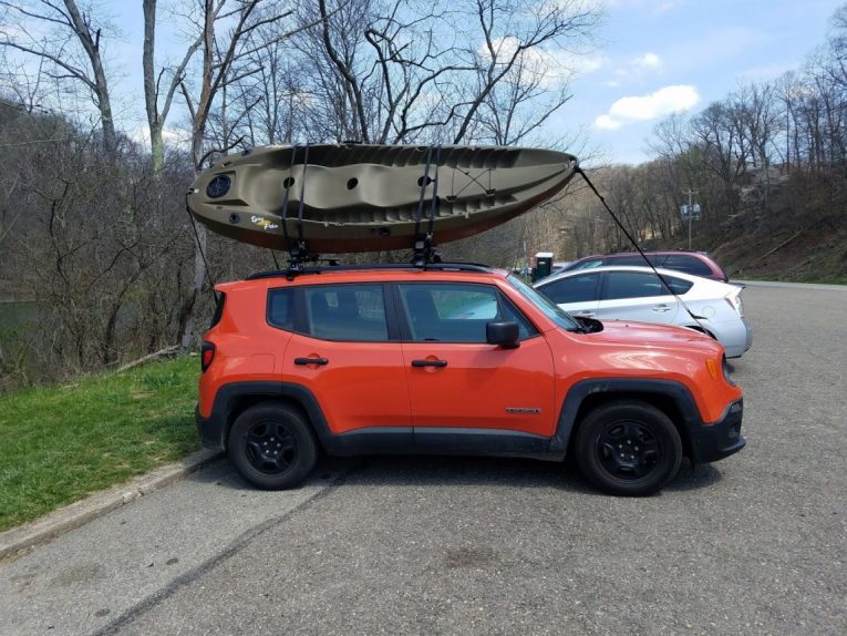 A boat on top of a car  Description automatically generated with medium confidence