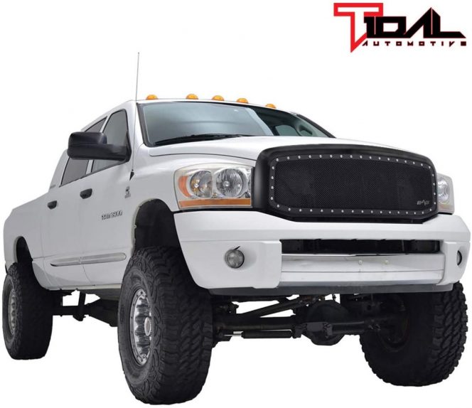 A white truck with large tires  Description automatically generated with low confidence